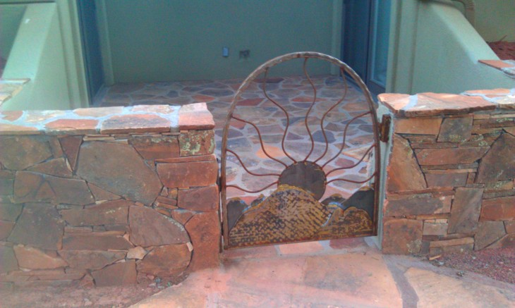 red rock wall and custom iron gate sedona contractor